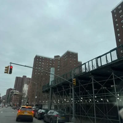 Sidewalk shed and scaffolding covering street in Queens New York for pedestrian safety